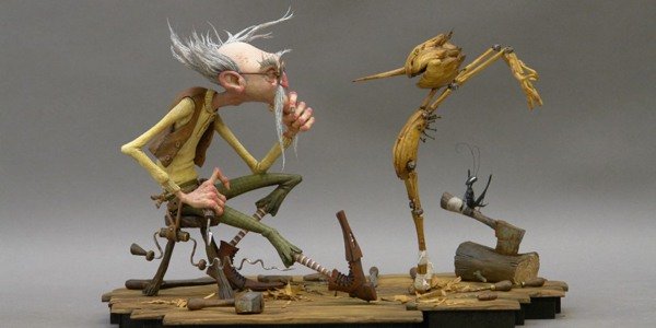 Ilustrasi resmi film Pinocchio garapan Guillermo del Toro dengan Geppetto dan boneka kayu Pinocchio